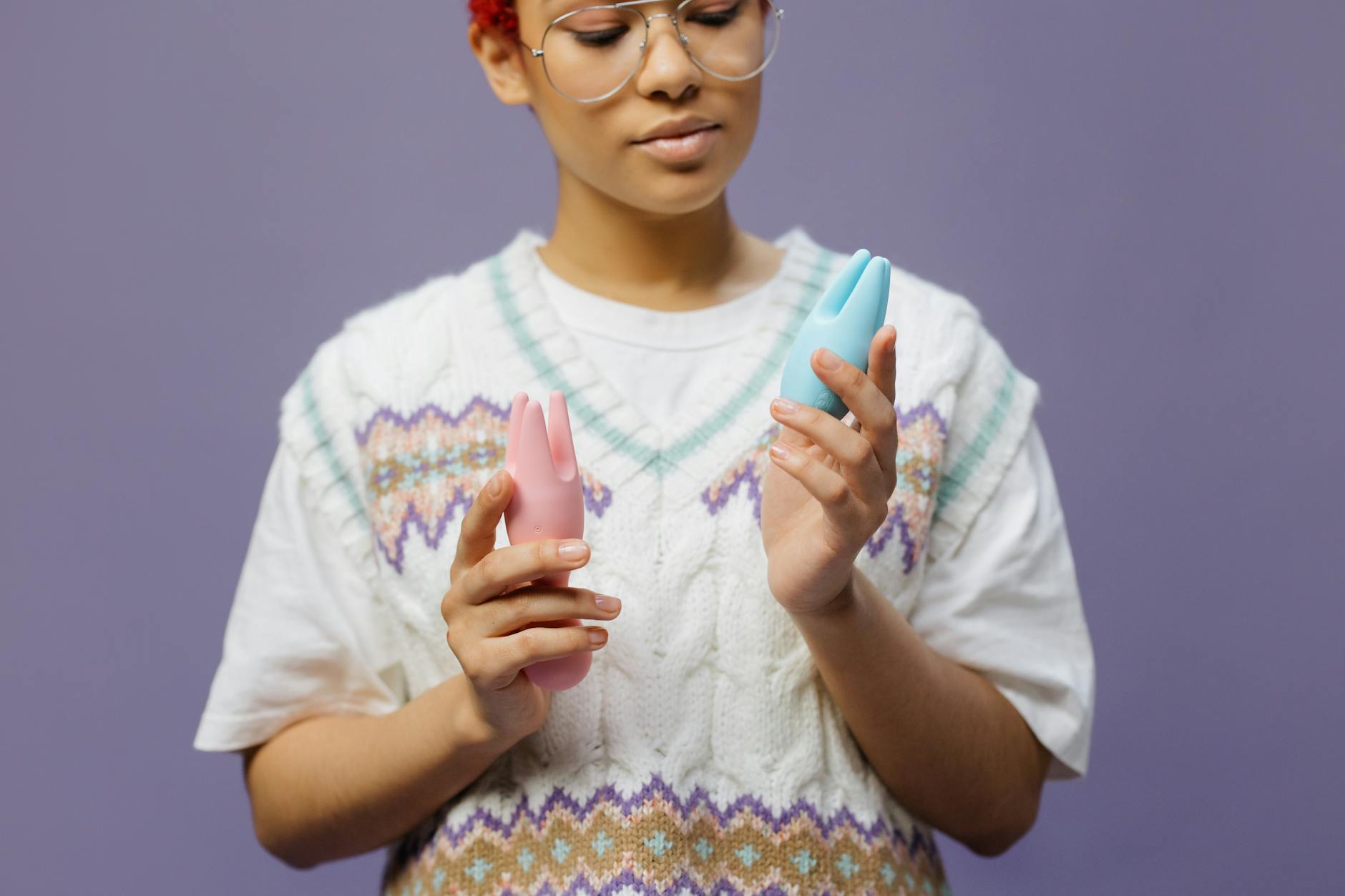 Woman holding lemon clitoral vibrators, considering pleasure options during low arousal periods