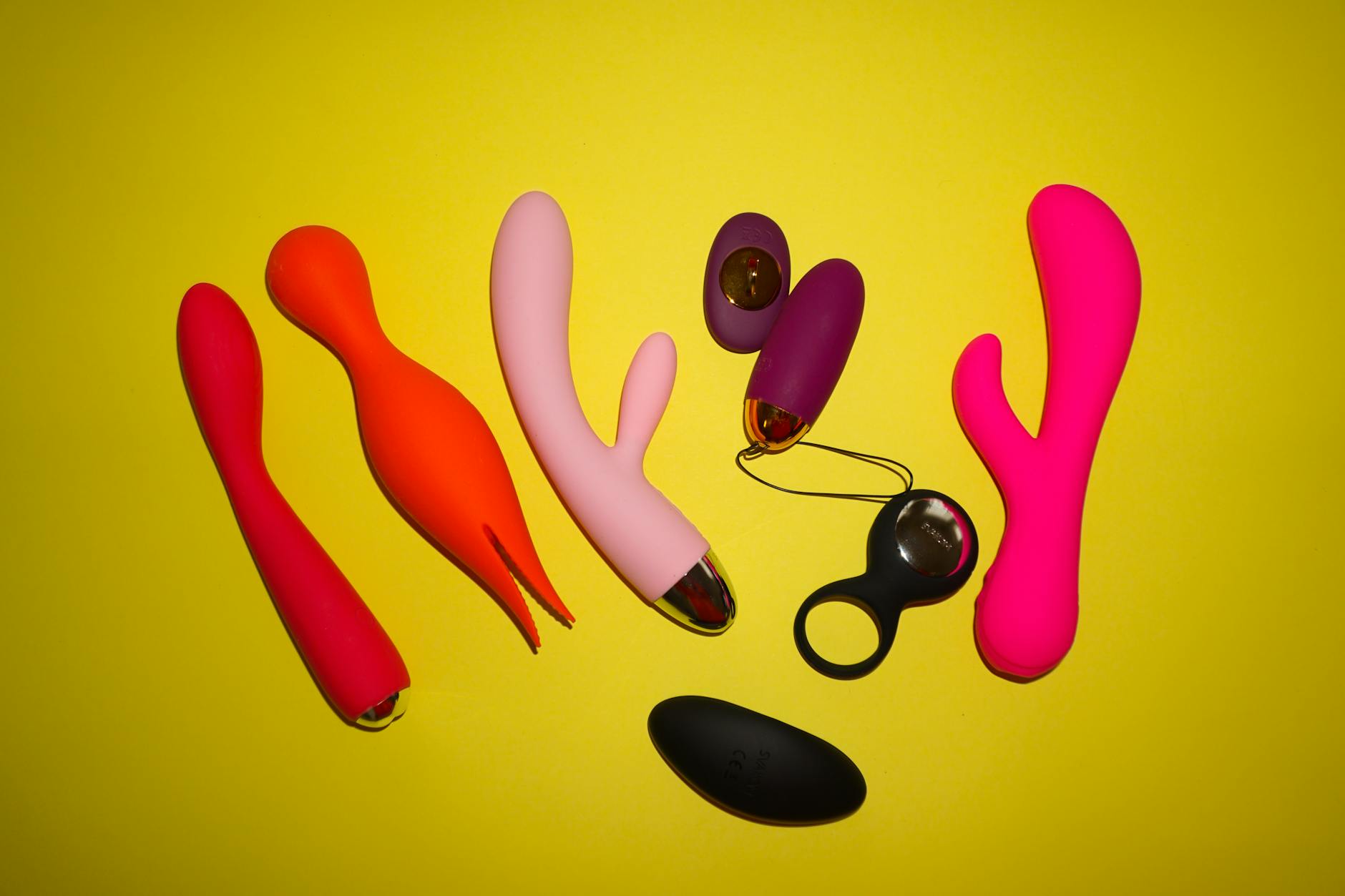 Hands holding a clitoral vibrator, reconnecting with sensation and pleasure